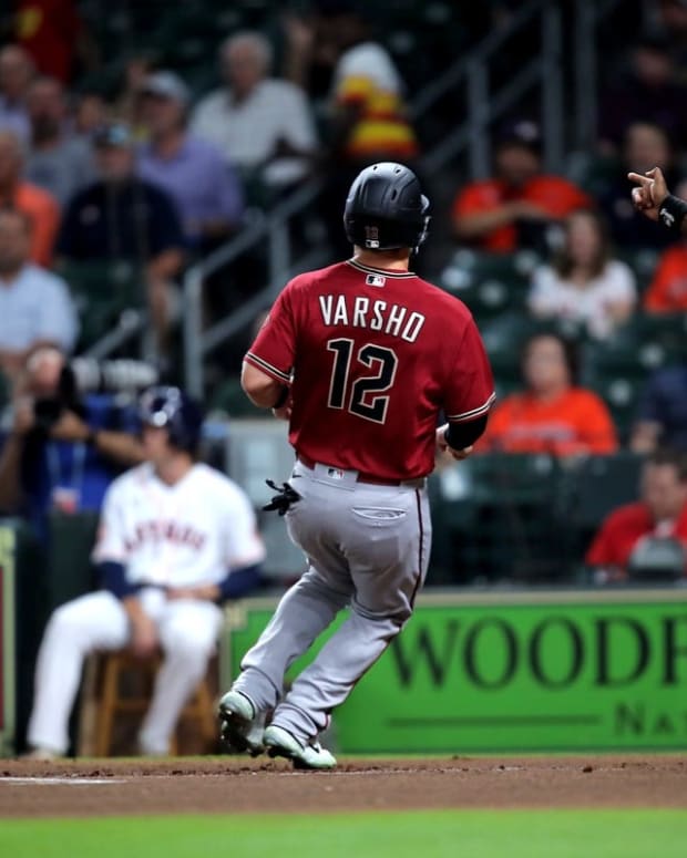 Sep 28, 2022; Houston, Texas, USA; Arizona Diamondbacks center fielder Daulton Varsho (12) crosses home plate to score a run against the Houston Astros during the first inning at Minute Maid Park. Mandatory Credit: Erik Williams-USA TODAY Sports
